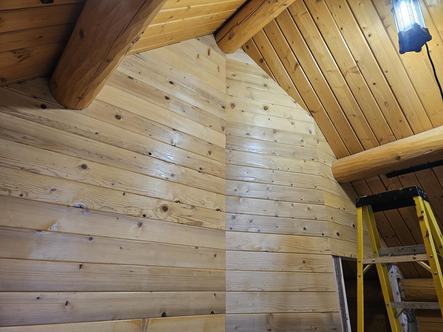 Custom wood paneling and vaulted ceiling work